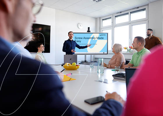 Coperion expert gives a training for a customer group in conference room