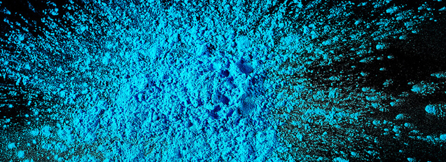 blue powder on black background