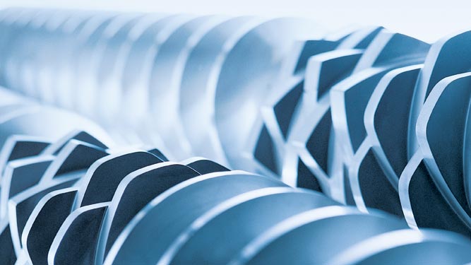 Coperion twin screw extruder screw elements lined up on screw shaft