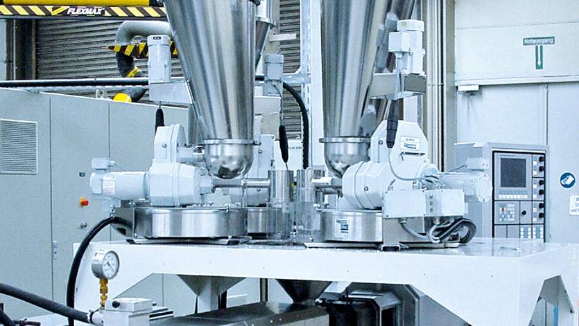 Coperion K-Tron single and twins screw feeders over an extruder inlet